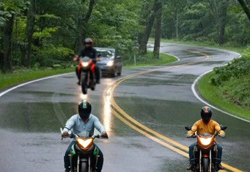Several motorcyclists are driving on the slippery asphalt road after the rain.