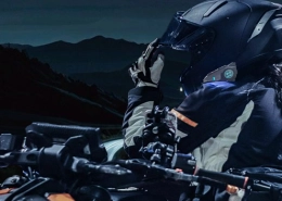 riding a motorcycle at night with a Bluetooth intercom